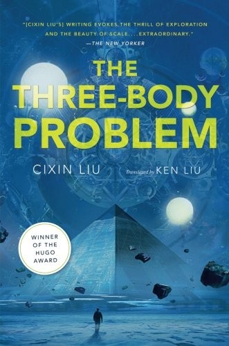 Cover of the Tor Books English-translation edition of Liu Cixin's The Three-Body Problem, showing a pyramid and moons above a lone figure on a frozen plain, with a Hugo Award winner banner